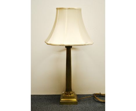 A brass column table lamp and shade, overall height 80cm.