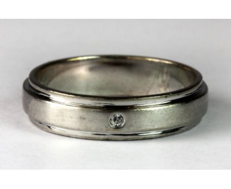 A gentleman's diamond set titanium ring (O).
