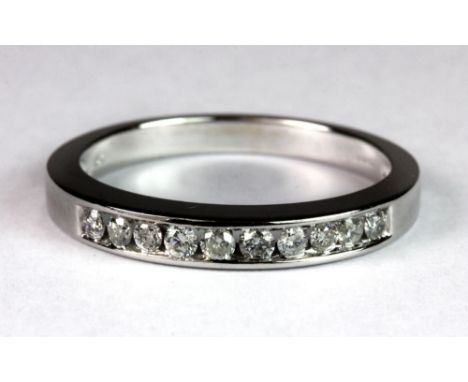 A 9ct white gold diamond half eternity ring, (P).