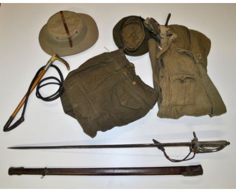 A WWI uniform, a polo helmet, a riding crop and a sword.