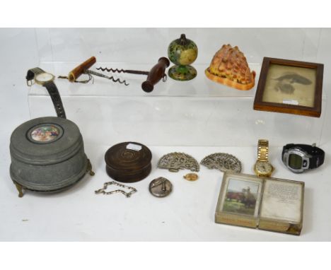 A collectors' lot comprising nurse's watch and belt buckle, corkscrews, playing cards, a musical box etc.