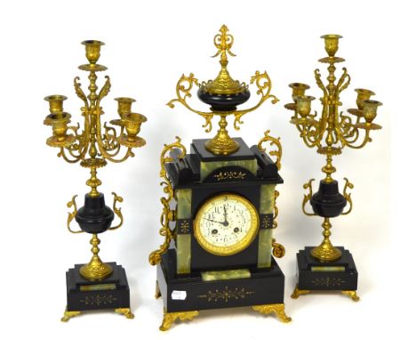A 20th century clock garniture in the French style, slate and onyx, the enamel dial set with Arabic numerals, height 53cm and