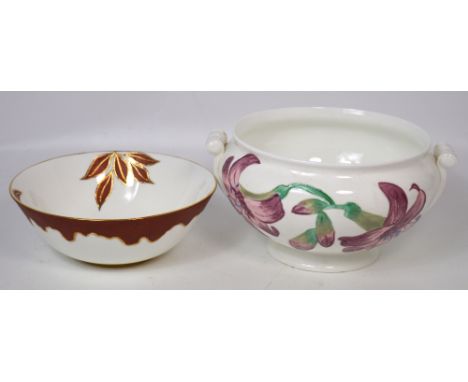 A hand painted ceramic bowl by J M Halhead, gilt heightened and decorated with Autumn leaves, signed to the base, diameter 24