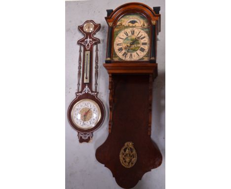 A reproduction walnut wall clock, the dial set with Roman numerals and a similar wall barometer af (2).