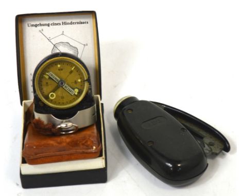 A cased German Bezard-Kompass compass in original black and white box and an AEG rechargeable hand held torch (2).