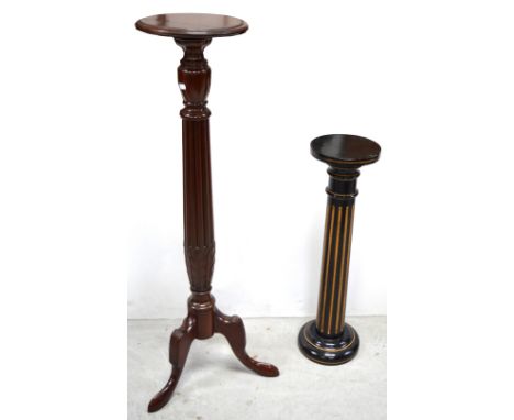 A 20th century jardinière stand raised on tripod support, height 122cm and a smaller earlier ebonised example on rounded base