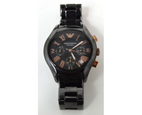 Armani; a Ceramica wristwatch with black face and rose gold logo, the dial set with Roman numerals and three subsidiary dials