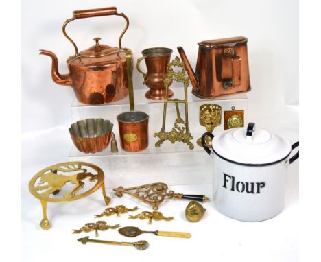 A quantity of metalware to include a copper haystack jug, a copper kettle, a fireside companion set, a brass fireguard, a cop