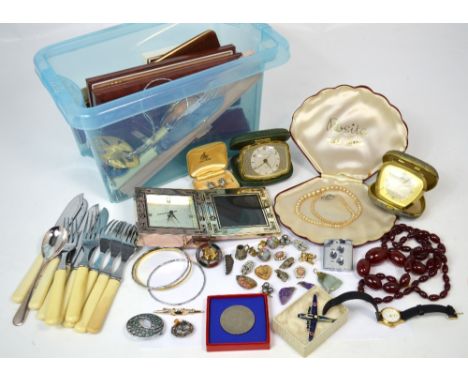 A quantity of costume jewellery to include silver brooches, pearl necklaces, an amber coloured bead necklace, coinage, a boxe