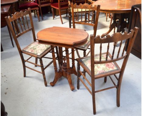 A small reproduction table raised on quadripartite base, width 60cm and a set of three floral upholstered stick back bedroom 