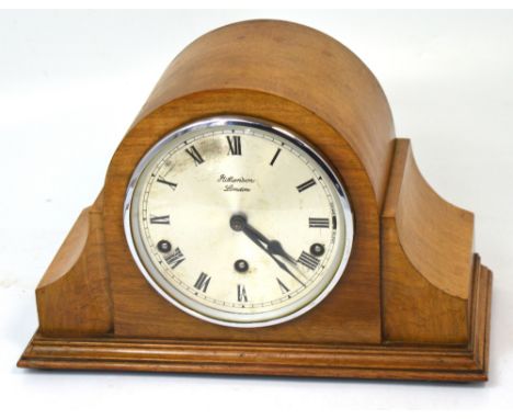 J W Benson; a mid 20th century oak cased eight day mantel clock, the silvered dial set with Roman numerals, height 23cm.