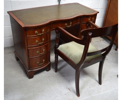 A nine drawer mahogany green leather inset desk on bracket feet, width is 115cm and a matched mahogany ladder back chair rais