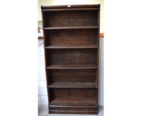 An oak Globe-Wernicke five shelf stacking bookcase with lower drawer, unglazed (af), width 88cm.