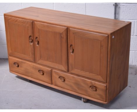 A retro Ercol style sideboard on castors, width 129cm.