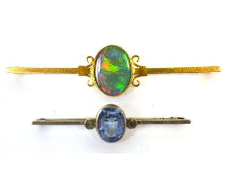 A 15ct yellow gold brooch set with an opal and a silver brooch set with a blue stone (2).