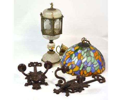 A Tiffany style light shade, a glass lantern style table lamp and a pair of wall sconces.