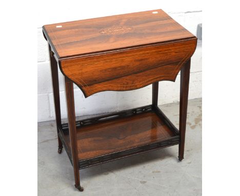 A 20th century mahogany dropleaf side table with inlay, the lower shelf with gallery sides on tapering legs and castors, unex