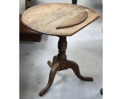 An oak occasional table with circular top above tripod support, width 67cm (af).