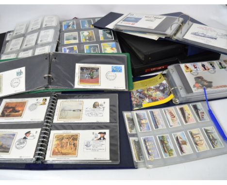 A quantity of first day covers contained within folders to include a 1982 'Maritime England' limited edition silk collection,