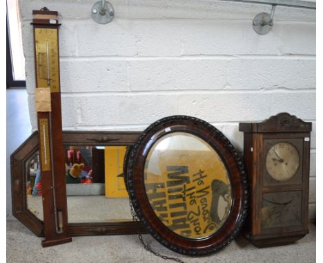 A 20th century oak cased eight day wall clock, the silvered dial set with Arabic numerals, a wall barometer and two wall mirr