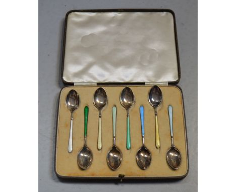 A cased set of eight George V hallmarked silver and enamel tea spoons, Birmingham 1935-1937, approx combined 2.8ozt.