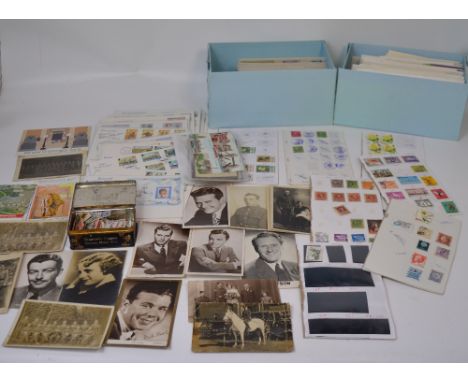 Two boxes of first day covers, further loose stamps and three empty red stamp albums etc.