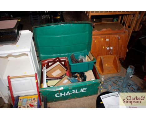 A metal trunk and contents to include horse related items, various prints, sundries etc. 