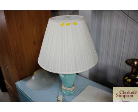 A green glazed table lamp and shade