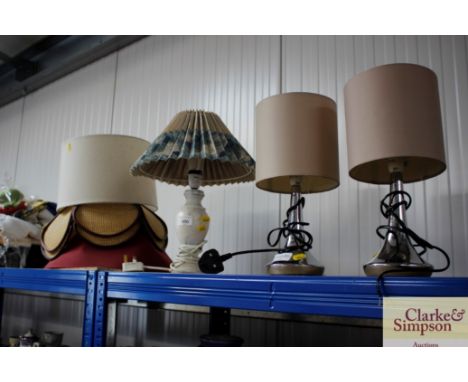 A pair of table lamps; one other table lamp and a collection of shades