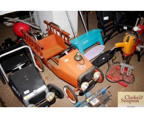 A children's toy pedal fire engine 