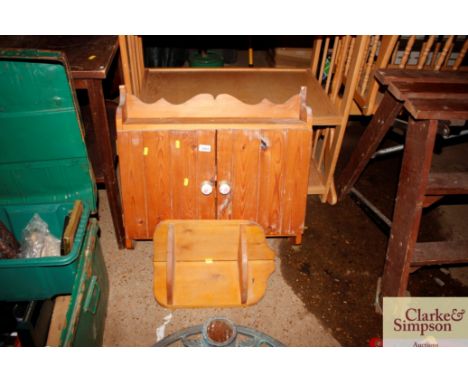 A pine wall cupboard; and small pine shelf 