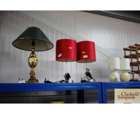 A wine rack; two pairs of table lamps and a brass table lamp