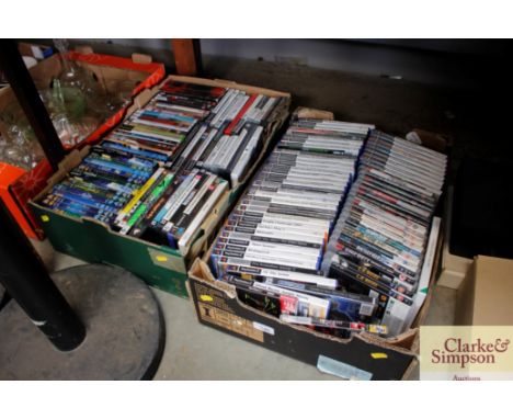 Two boxes containing DVD's and various console games