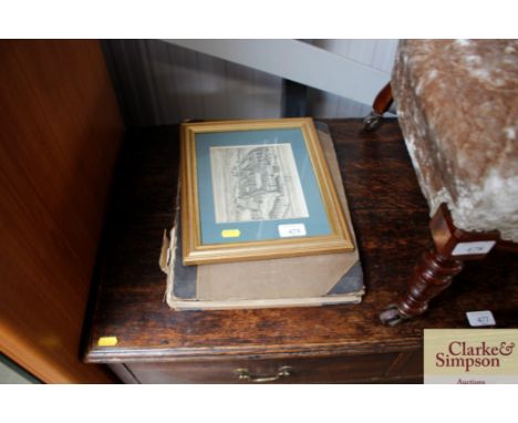 A gilt framed black and white etching and an album containing numerous watercolours and sketches 