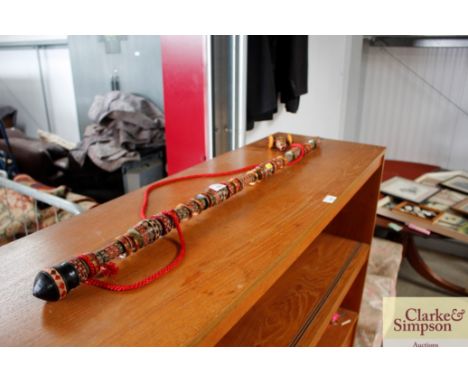 A decorative carved wooden pipe