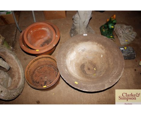 A large circular planter and three others