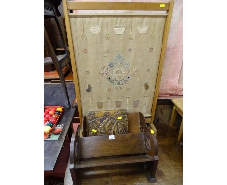 Two vintage book racks, an acorn carved lidded box and a needlework panel firescreen decorated with fruit, flowers, animals, 