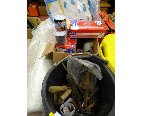 Roll of fibreglass and five boxes of vinyl gloves, ground sheet and a black bucket of various hand tools, spoke shave, mortis