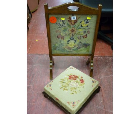 Oak framed needlework firescreen and a tapestry top antique footstool on turned bun feet