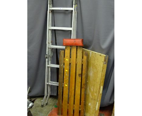 Small aluminium ladder along with a pasting table and a wooden undercar creeper