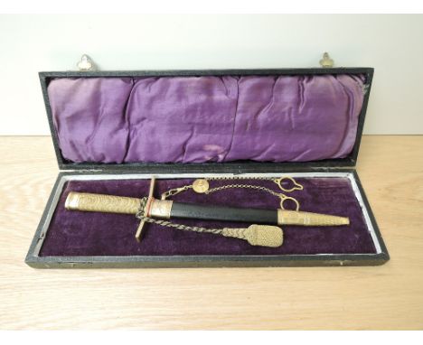 A M-1930 Swedish Air Force Officers Dress Dagger with single hanging mount to the scabbard, top pommel with the three Swedish