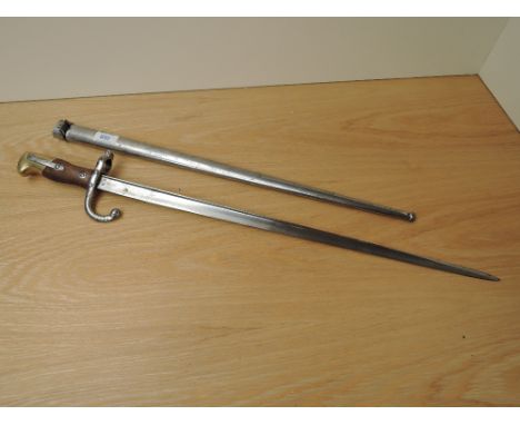 A French Gras Rifle Bayonet model 1874 with scabbard scabbard and blade marked 65838 blade length 52cm overall length 64cm