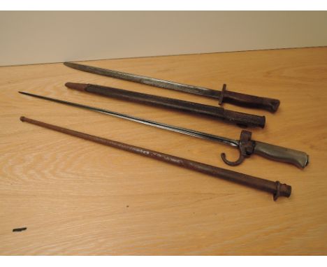 A French Lebel Epee Bayonet 1886 pattern, blade length 51cm, overall length 63cm, with scabbard along with a British 1907 pat