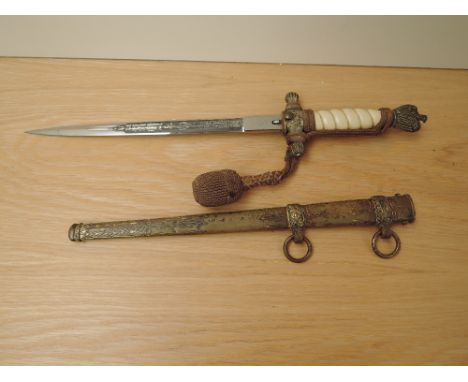 A WWII German Naval Officers Dress Dagger by Eickhorn Solingen, engraved blade, metal scabbard and portepee knot, blade lengt