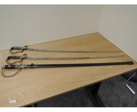 Three German WWII Swords, two blades marked Eickhorn, Solingen, blade lengths 86cm, overall lengths 98cm, both without scabba