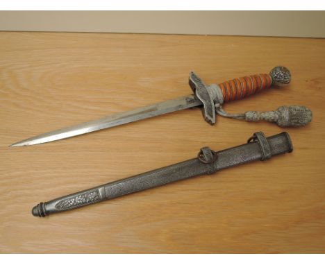 A German Third Reich Officers Dress Dagger by Eickhorn, metal scabbard, portepee knot, blade length 25cm, overall length 38cm