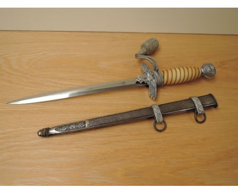 A German Third Reich Officers Dress Dagger by ROBt Klasse Solingen, metal scabbard, portepee knot, blade length 26cm, overall