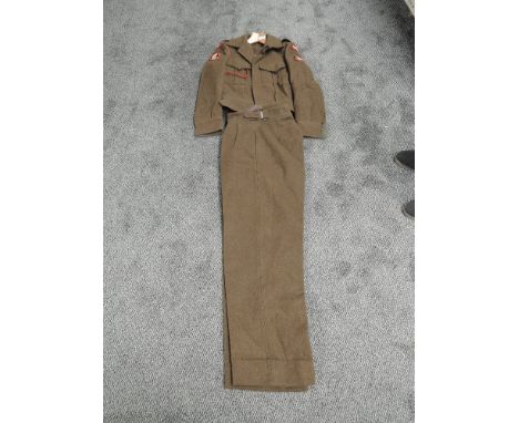 A WW2 period Officers Battle Dress Blouse and Trousers, Border Regiment 11th Battalion with cloth pips to shoulders, small si