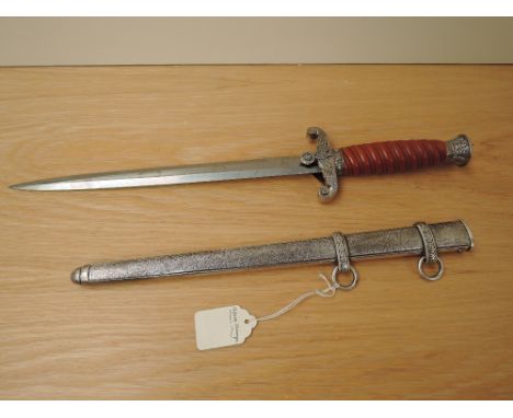 A German Third Reich Officers Dress Dagger by WKC Solingen, metal scabbard, blade length 26cm, overall length 37cm