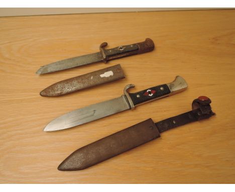 Two German WWII Hitler Youth Daggers, one blade marked Awton Wingen Solingen, blade length 13cm with metal scabbard and secon